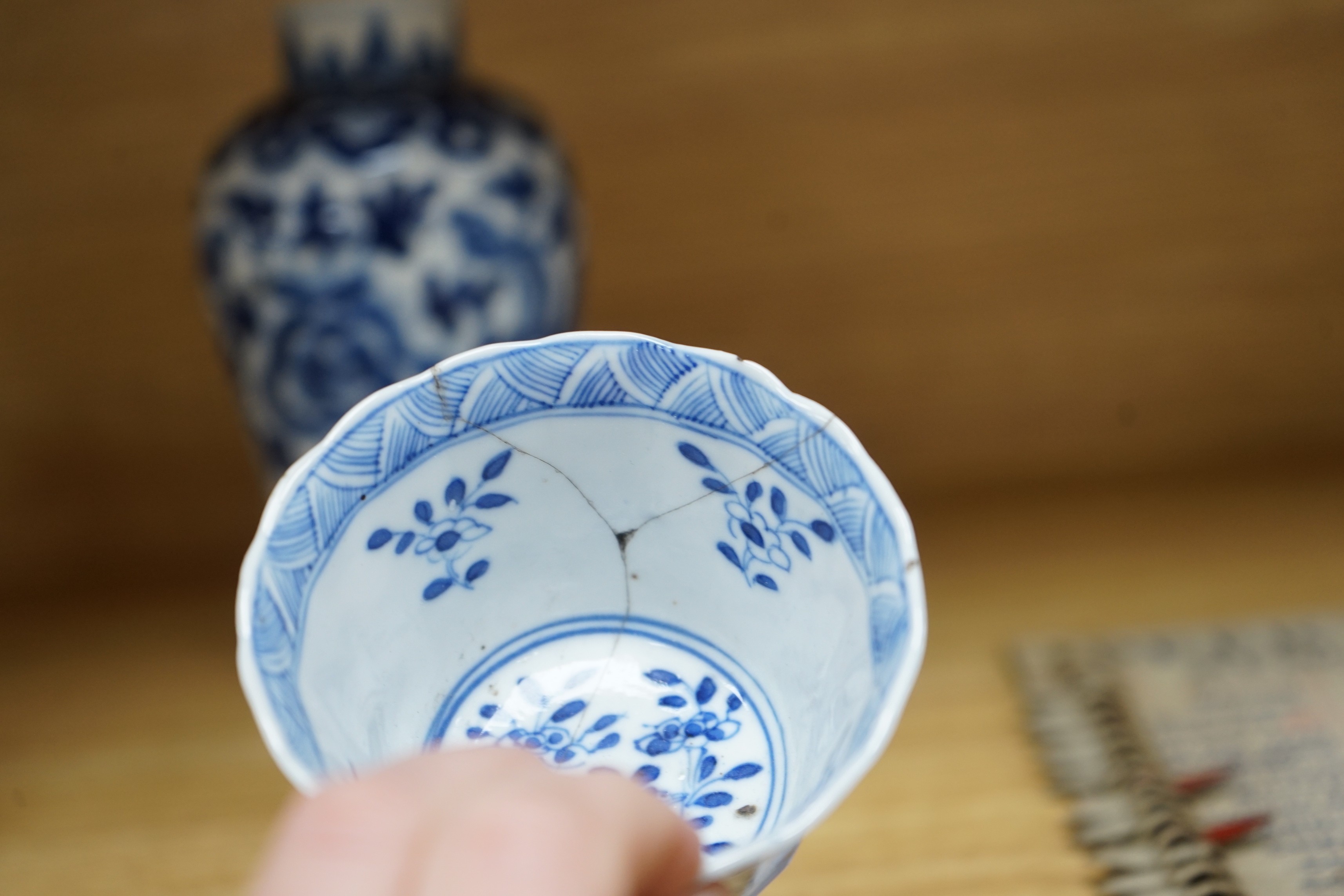 A Chinese blue and white phoenix decorated vase, a pair of circular boxes and a pair of damaged tea bowls. Late 19th century Tallest 17.5cm